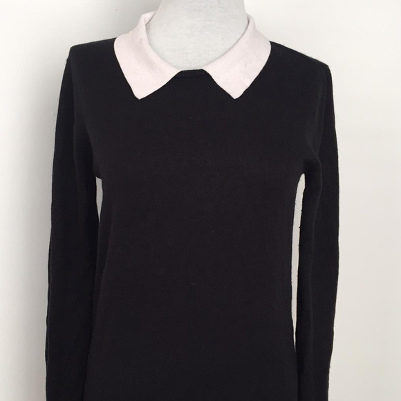 black sweater with white collar
